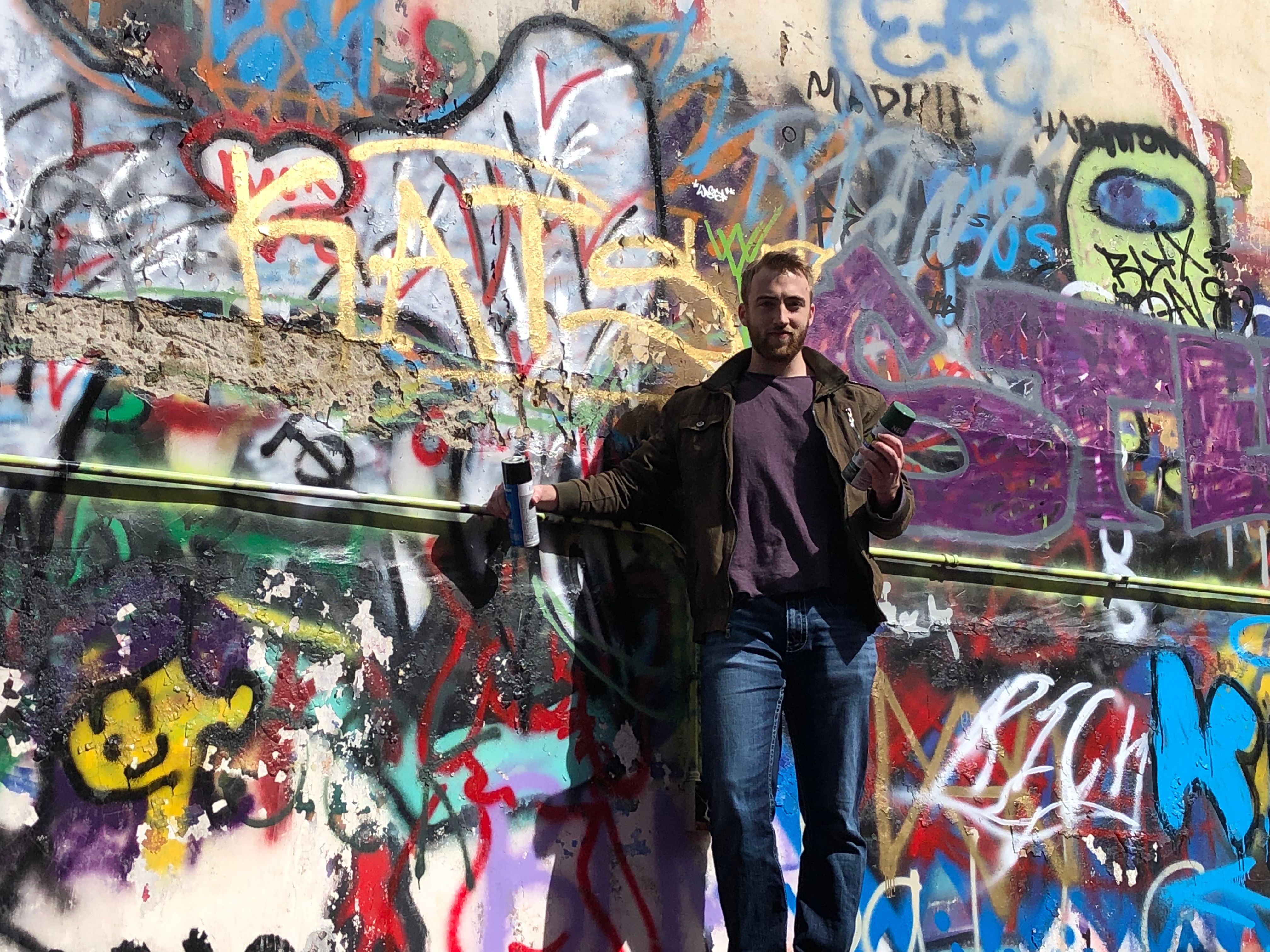 Nathan stands on top of a shipping container